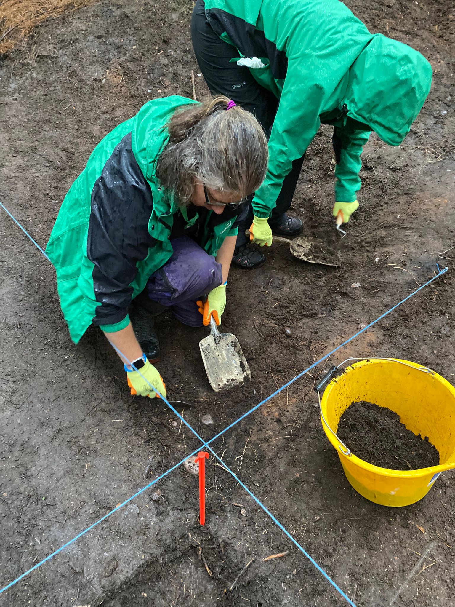 Photograph of a couple of people excavating Sherwood Pines